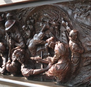 The left hand panel of the Battle of Britain Memorial shows the women working in a factory making a wing for a fighter plane