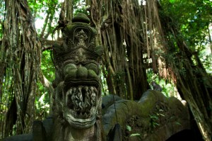 The face of a dragon on the end of the serpentine bridge over a gorge in the Money Forest in Ubud