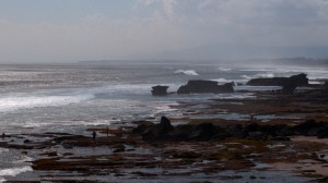 The waves roll in across the Indian Ocean and crash on the shore north of Tanah Lot in Bali